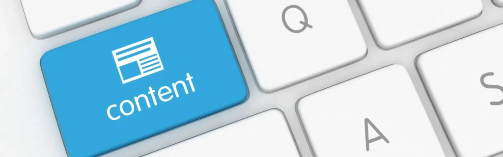 Tecla blava amb la paraula 'content' en un teclat per a estratègies de màrqueting de continguts B2B.